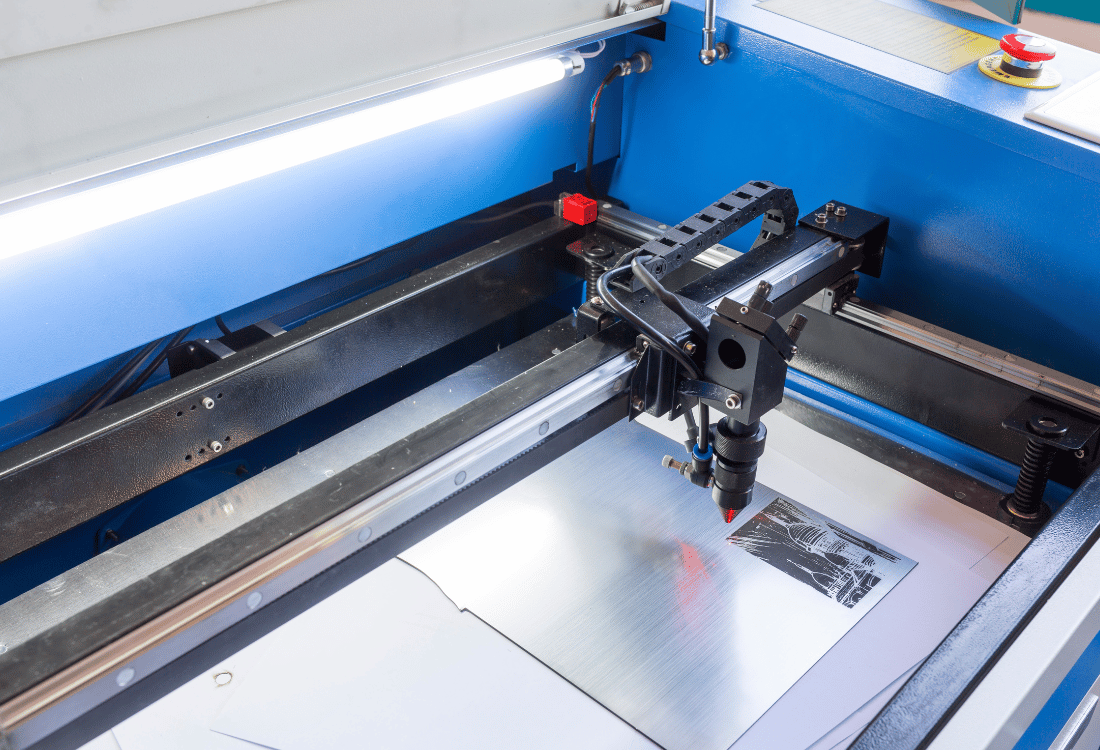 A universal laser machine cutting through tough materials needed for production.