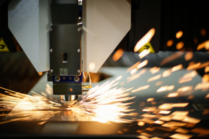 A laser cutter cutting various materials such as metal, acrylic and wood.
